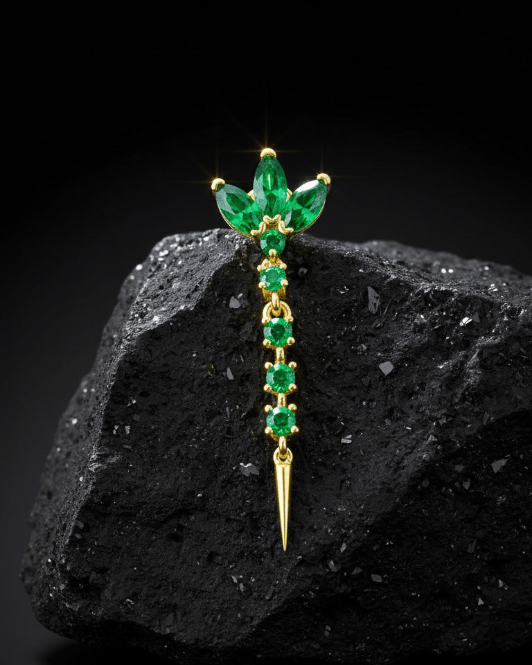 lotus shape stud earring with dangling line of emerald color stones.