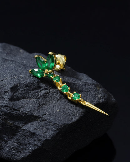 lotus shape stud earring with dangling line of emerald color stones.