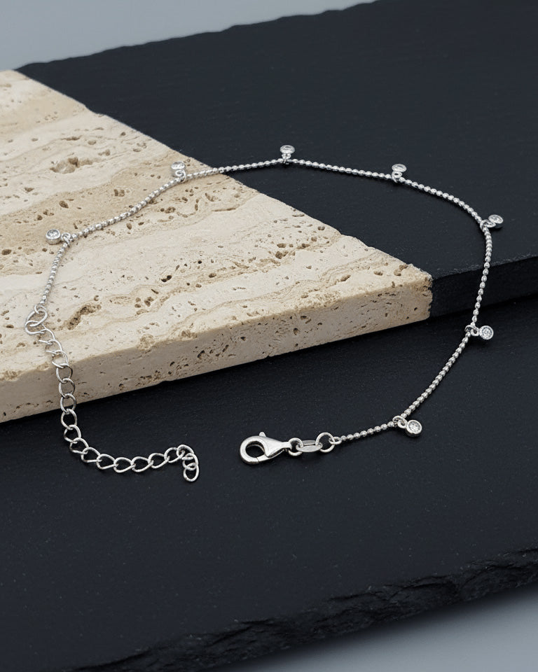 faceted beads anklet with dangling round CZ in bezel setting.