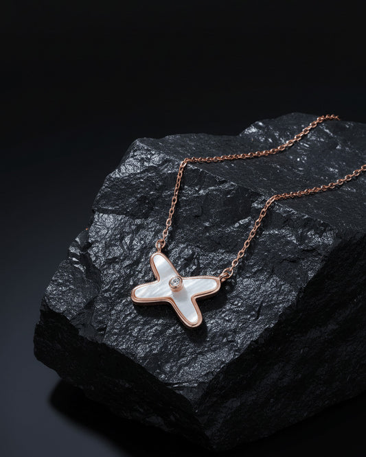 rose gold mother of pear X shape necklace.