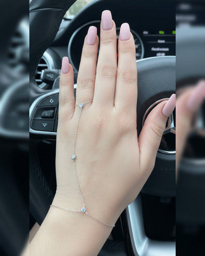 Delicate hand piece with CZ in bezel setting.
