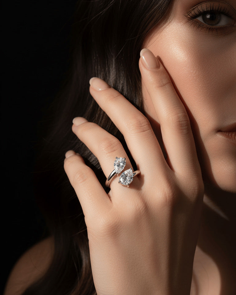 open ring of two pear shape CZ.