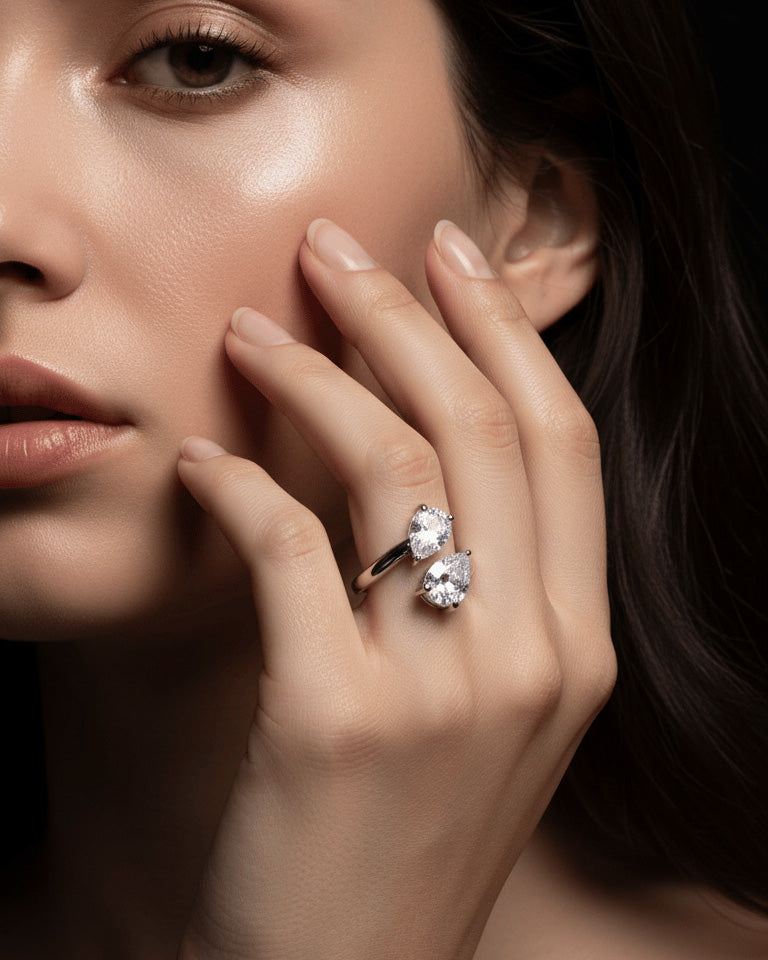 open ring of two pear shape CZ.