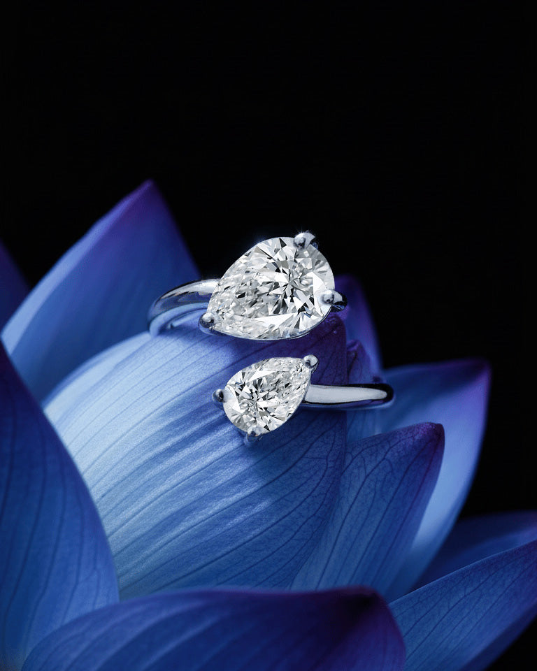 open ring of two pear shape CZ.