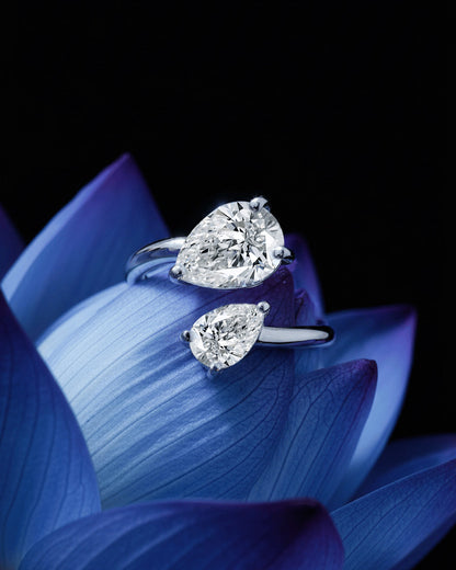 open ring of two pear shape CZ.