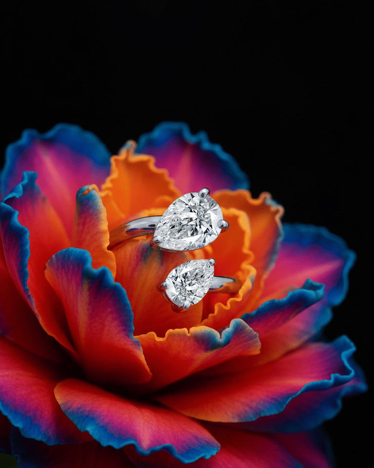 open ring of two pear shape CZ.