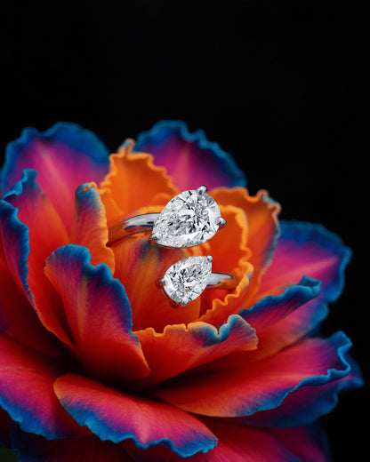 open ring of two pear shape CZ.