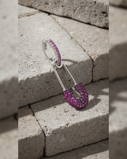 8 mm colored CZ huggie hoop with dangling safety pin shape.