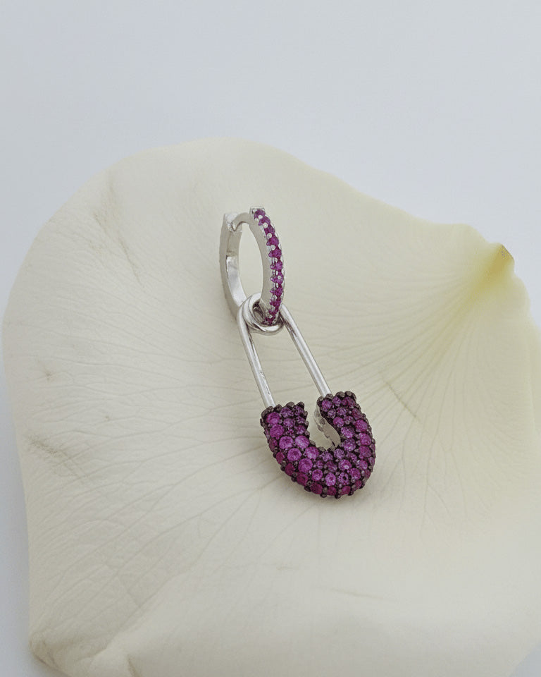 8 mm colored CZ huggie hoop with dangling safety pin shape.