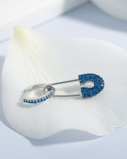 8 mm colored CZ huggie hoop with dangling safety pin shape.