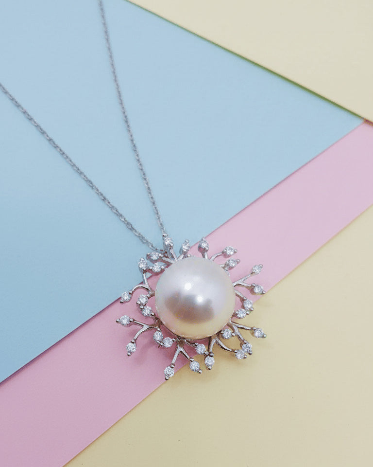 Pearl necklace with CZ stones.