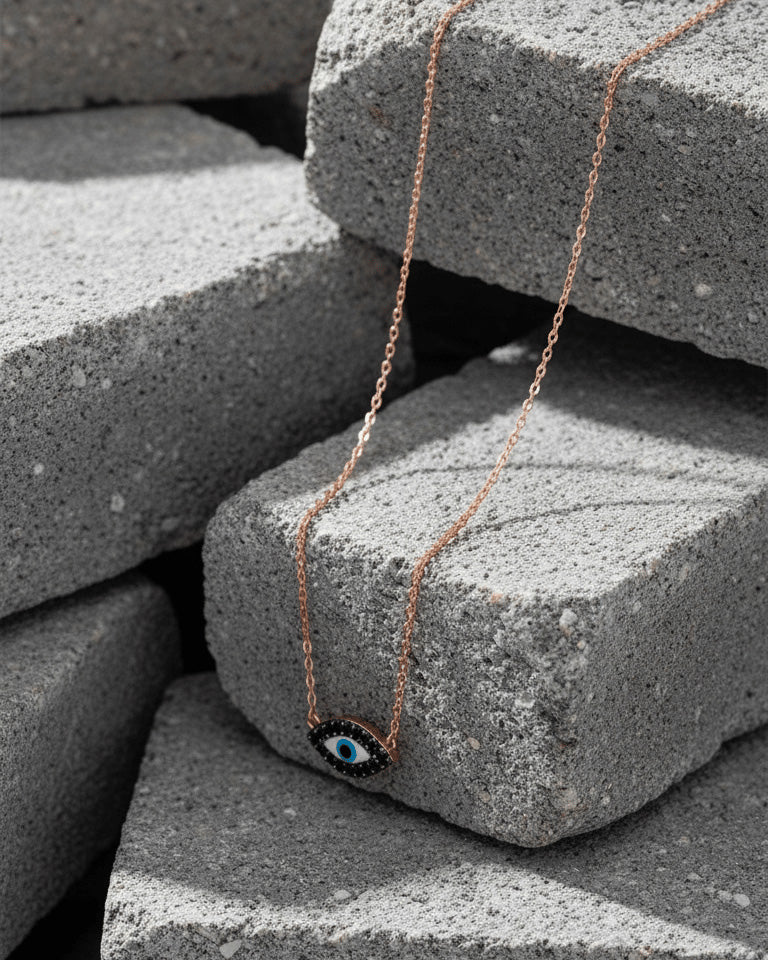 rosegold onyx evil-eye necklace.