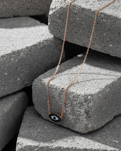 rosegold onyx evil-eye necklace.