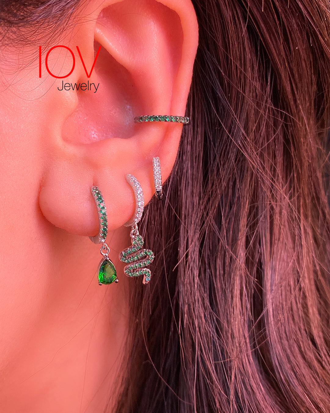 dangling green snake hoops.
