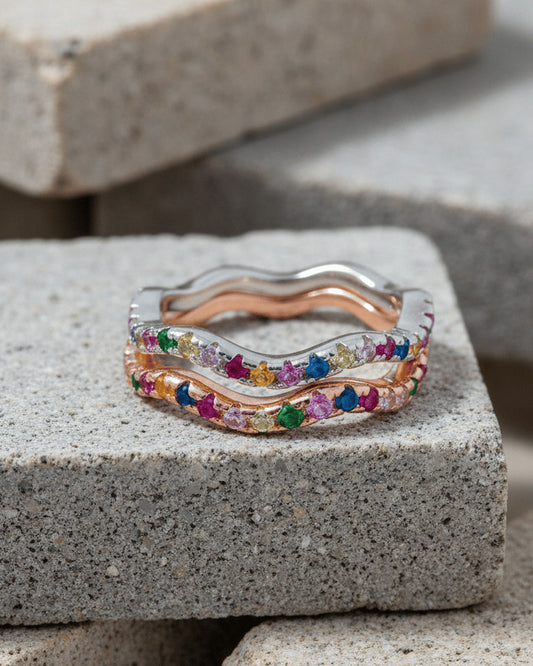 sterling silver wavy eternity rings of rose gold and rhodium color studded with colored CZ.