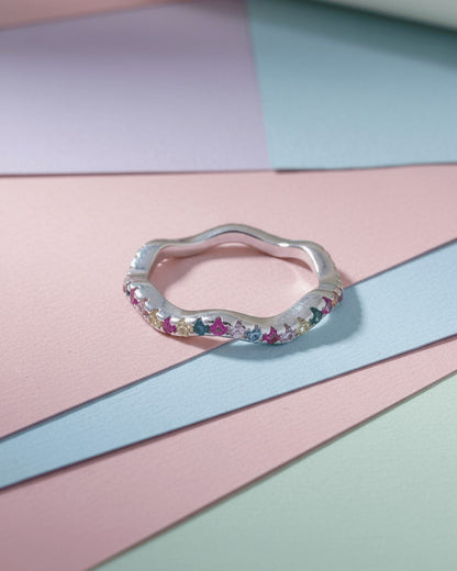 sterling silver wavy eternity rings of rose gold and rhodium color studded with colored CZ.