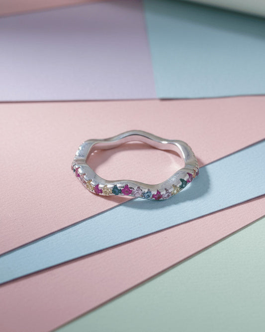 sterling silver wavy eternity rings of rose gold and rhodium color studded with colored CZ.