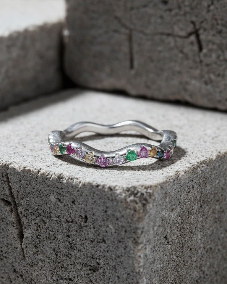 sterling silver wavy eternity rings of rose gold and rhodium color studded with colored CZ.