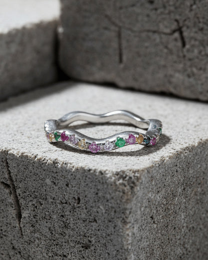 sterling silver wavy eternity rings of rose gold and rhodium color studded with colored CZ.