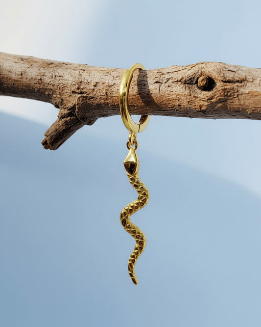 Huggie hoop dangling snake earring.