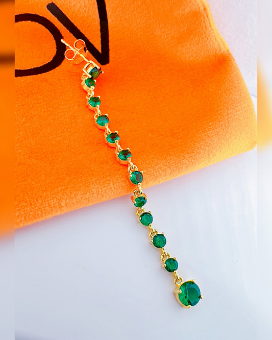 long line of emerald color round stones stud earring.