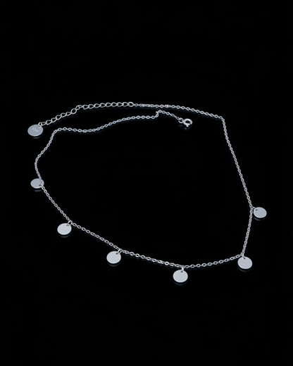 delicate necklace of dangling plain coins.