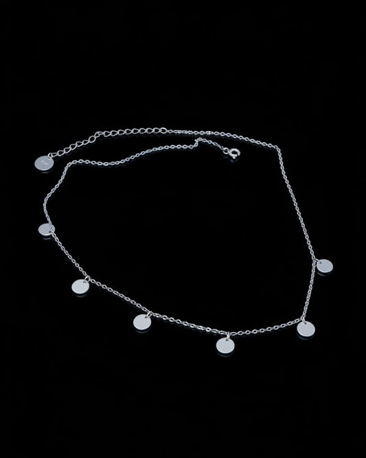 delicate necklace of dangling plain coins.