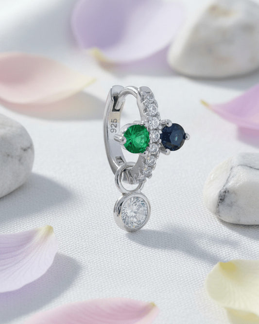 Huggie hoop of green and black stones with dangling detachable round stone in bezel setting.