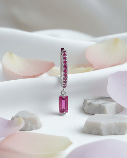 9 mm fuchsia color stones huggie hoop with dangling baguette shape.