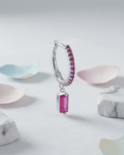 9 mm fuchsia color stones huggie hoop with dangling baguette shape.