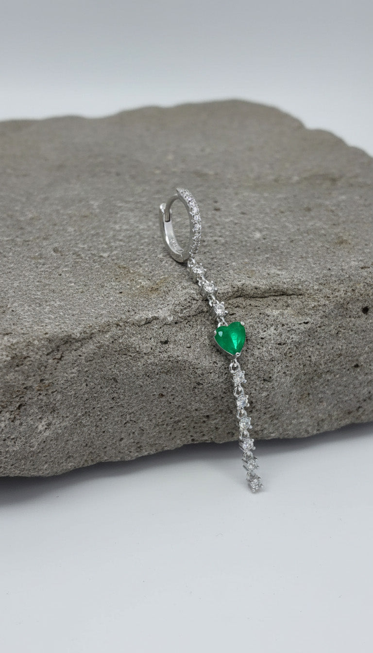 CZ huggie hoop with dangling line of CZ and emerald color heart shape.