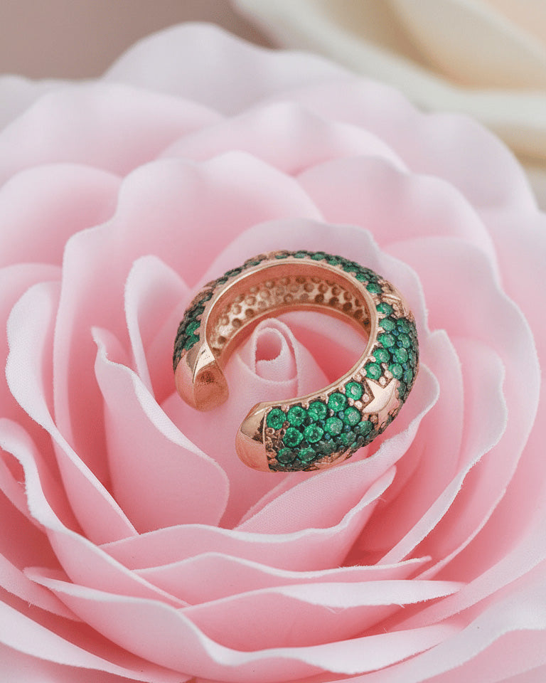 rose gold and yellow gold wide earcuffs with ruby and emerald color stones.