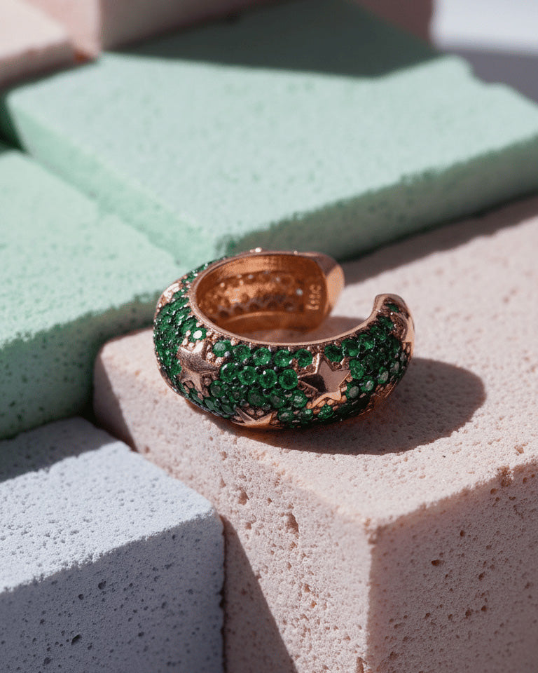 rose gold and yellow gold wide earcuffs with ruby and emerald color stones.