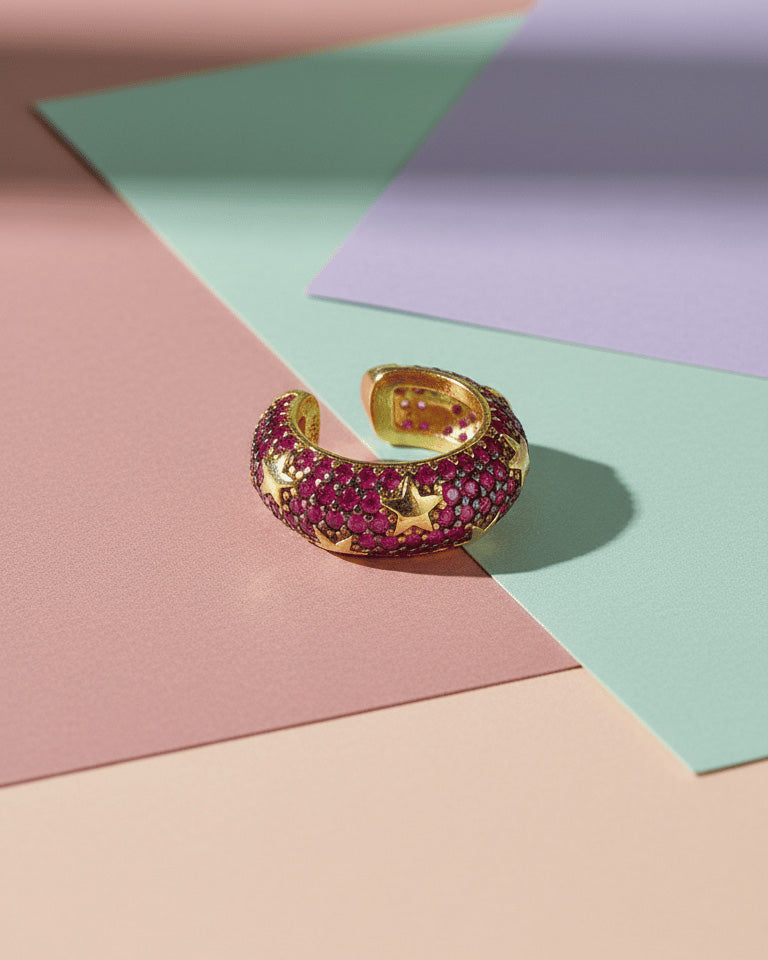 rose gold and yellow gold wide earcuffs with ruby and emerald color stones.