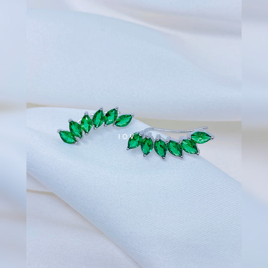emerald color marquise stones curved climber earrings.