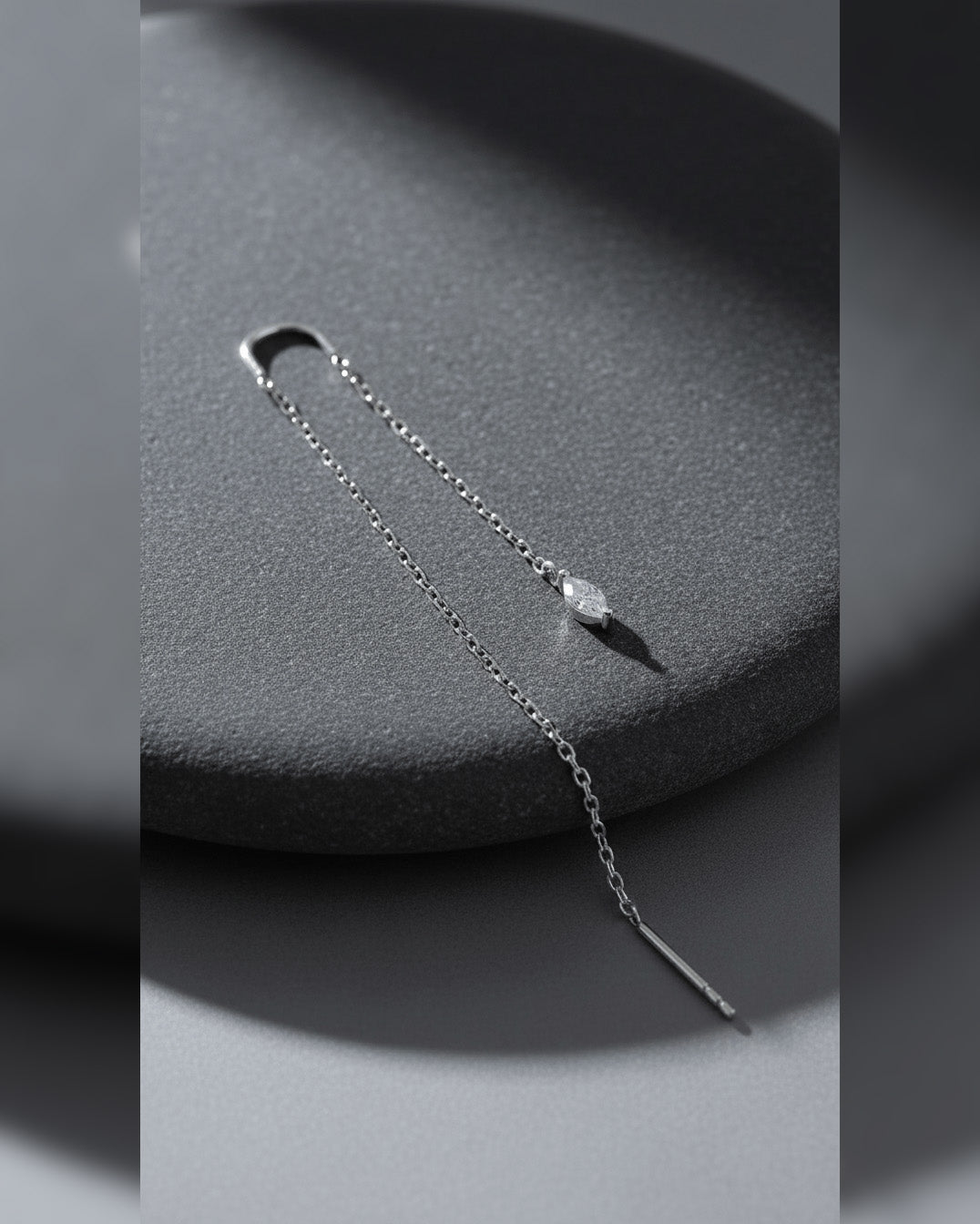 threader earring with dangling marquise shape CZ stone.