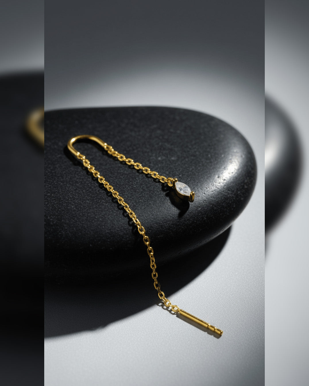 threader earring with dangling marquise shape CZ stone.
