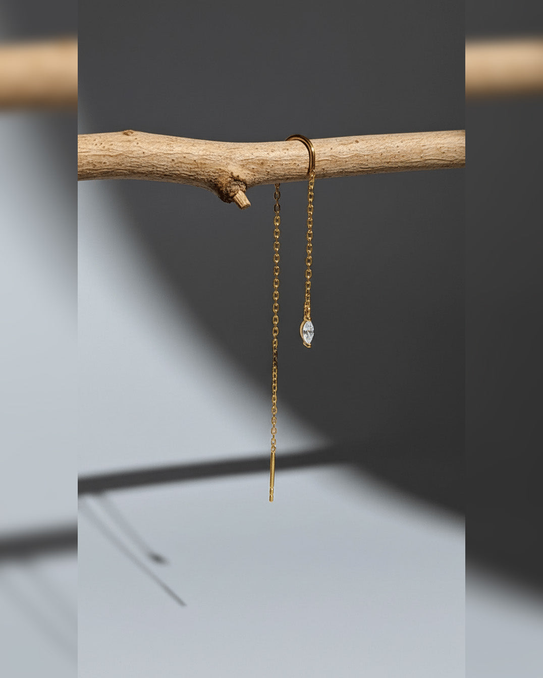 threader earring with dangling marquise shape CZ stone.