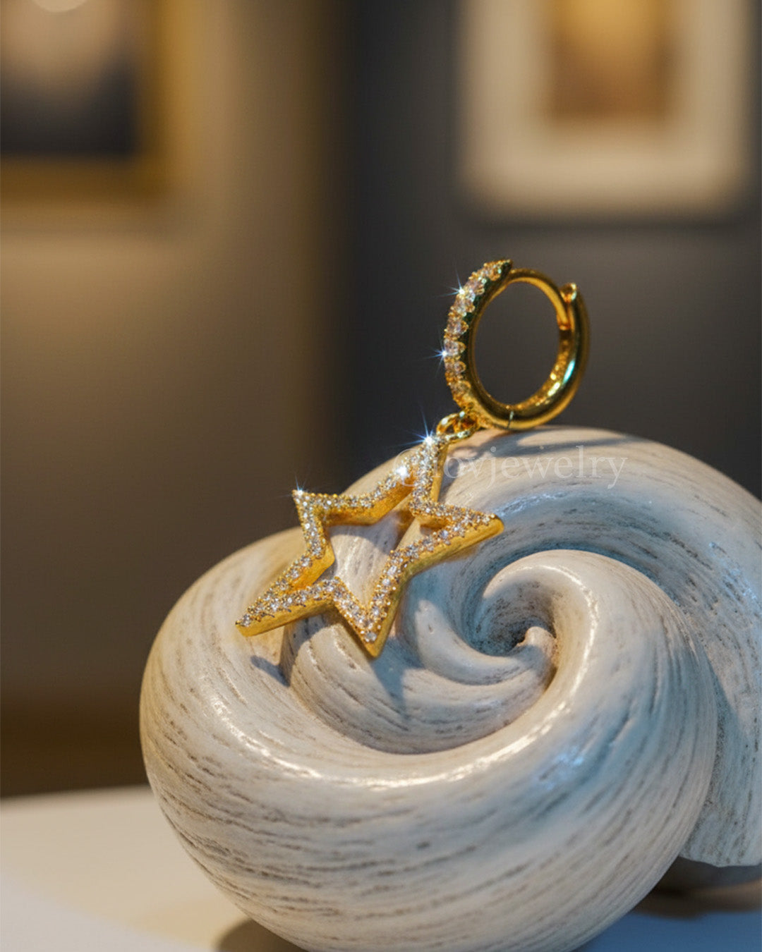 CZ huggie hoop with dangling star shape earring.