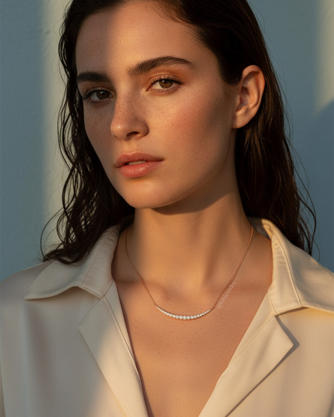 curved bar of graduated cz stones necklace.