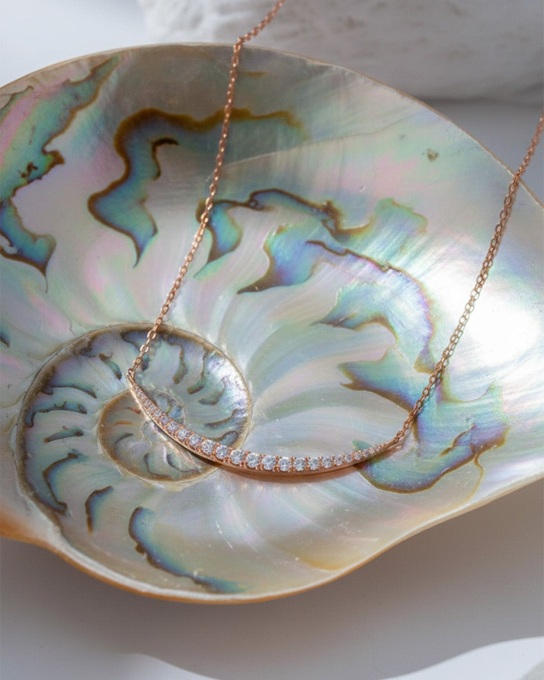 curved bar of graduated cz stones necklace.