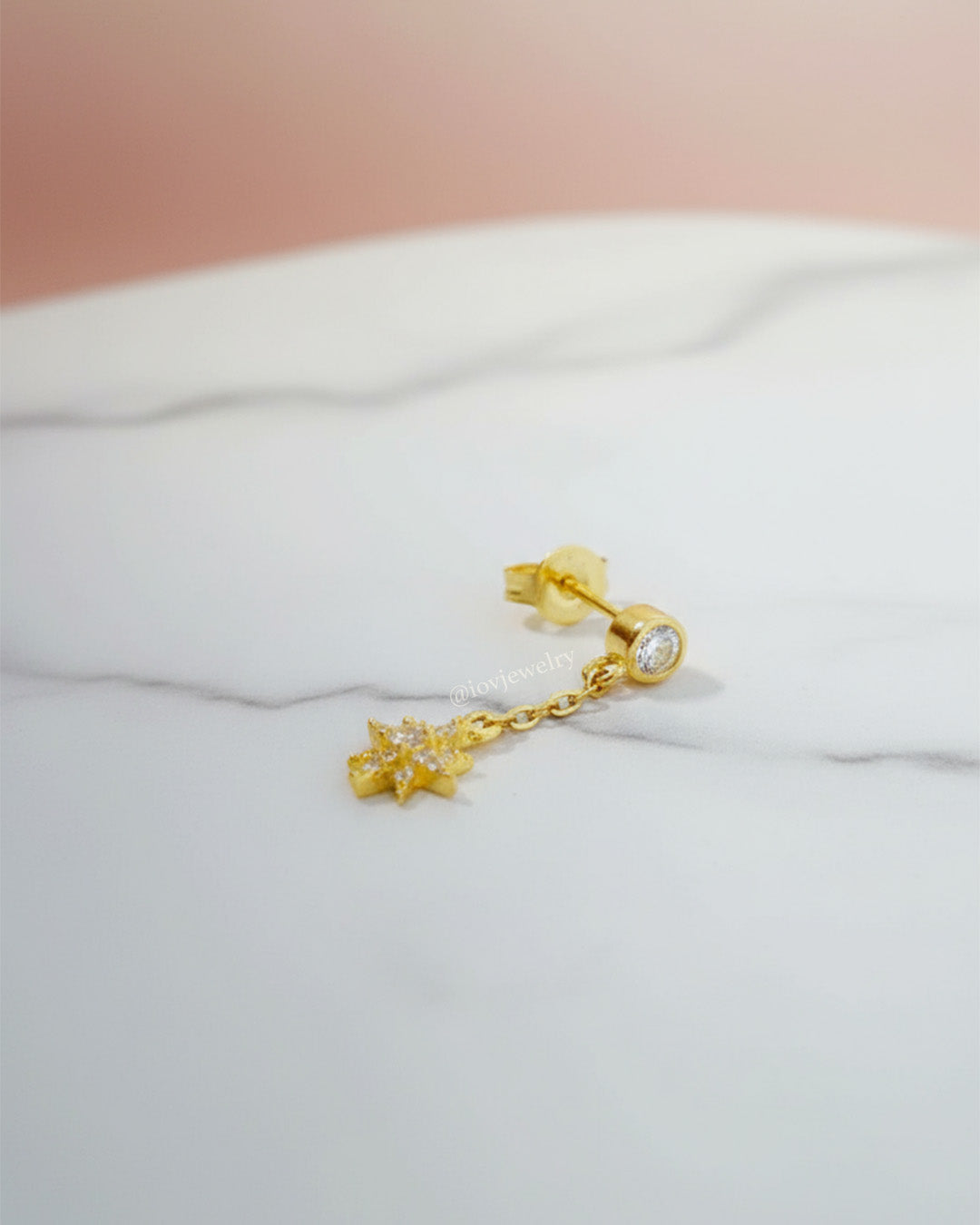 CZ round stone in bezel setting with delicate dangling star shape stud earring.