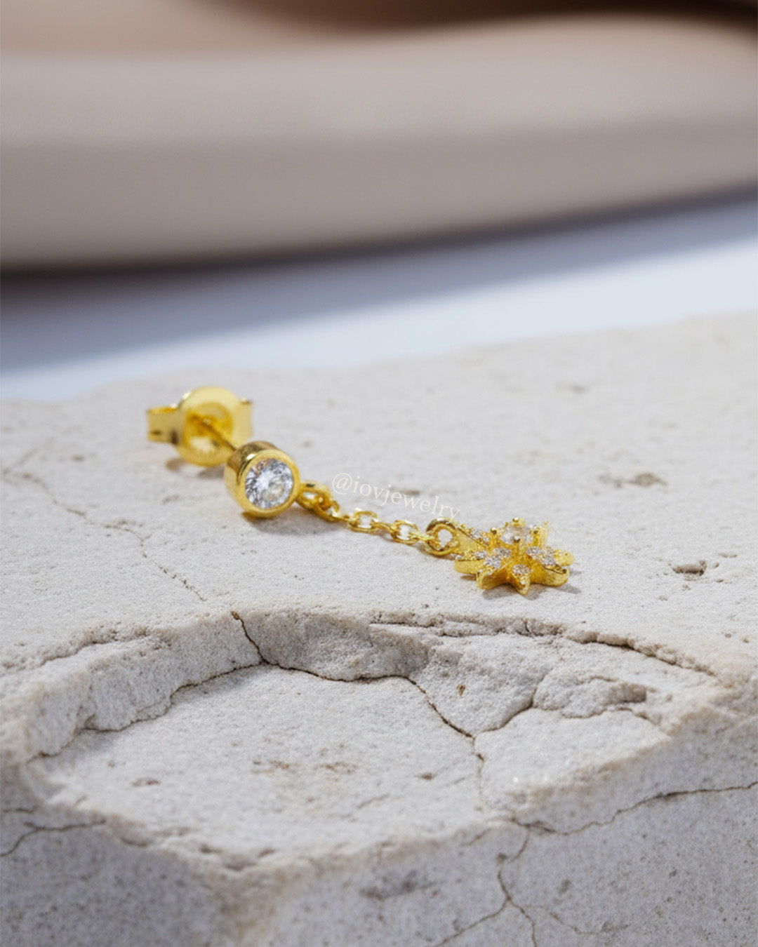 CZ round stone in bezel setting with delicate dangling star shape stud earring.