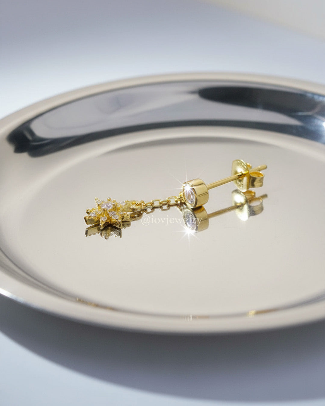 CZ round stone in bezel setting with delicate dangling star shape stud earring.