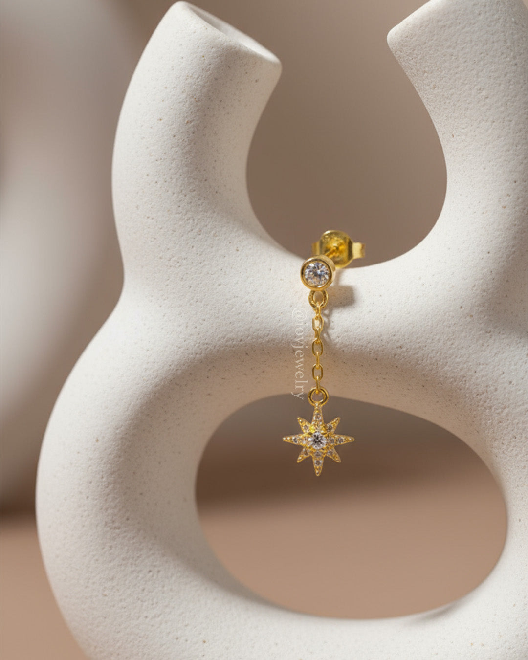 CZ round stone in bezel setting with delicate dangling star shape stud earring.