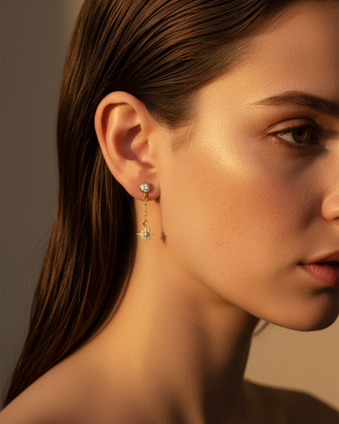 CZ round stone in bezel setting with delicate dangling star shape stud earring.