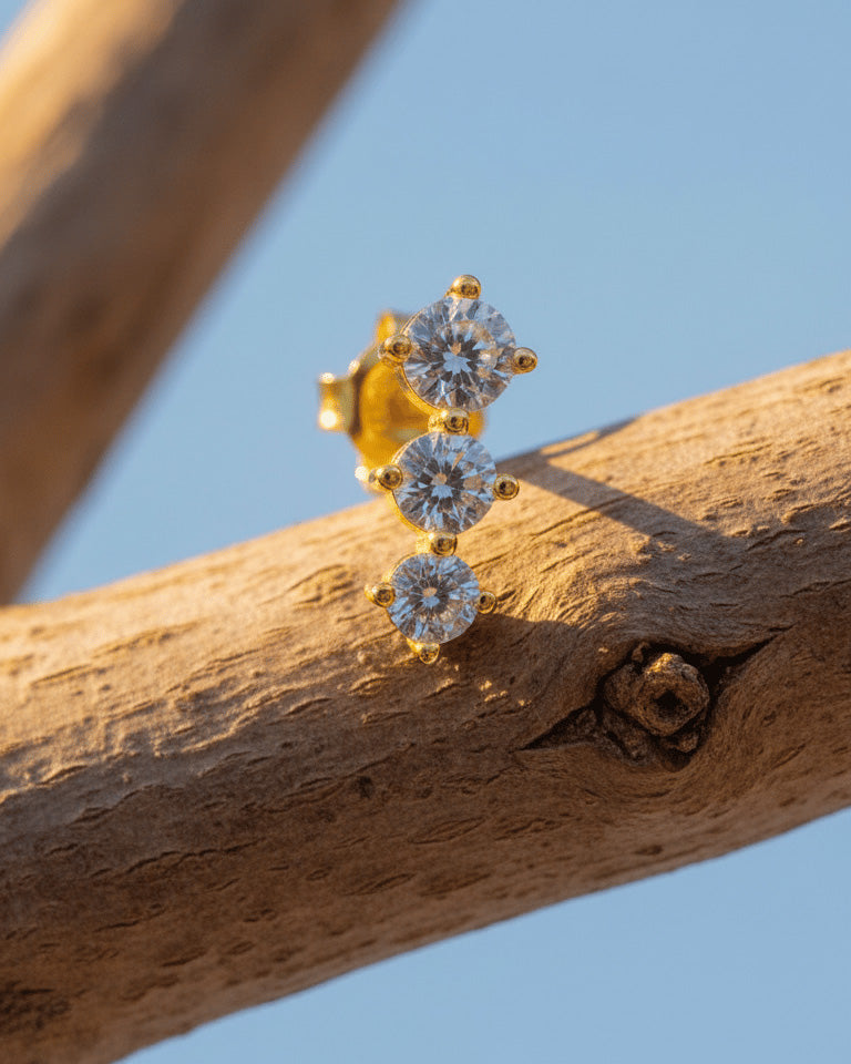Three graduated round CZ stones stud earring.