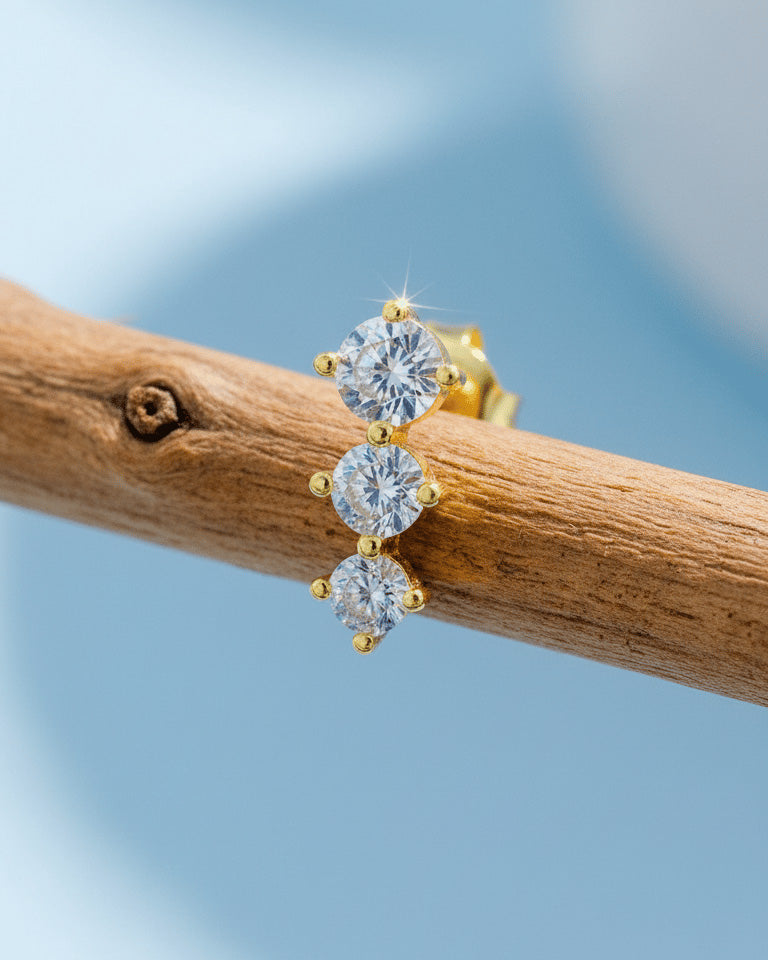 Three graduated round CZ stones stud earring.