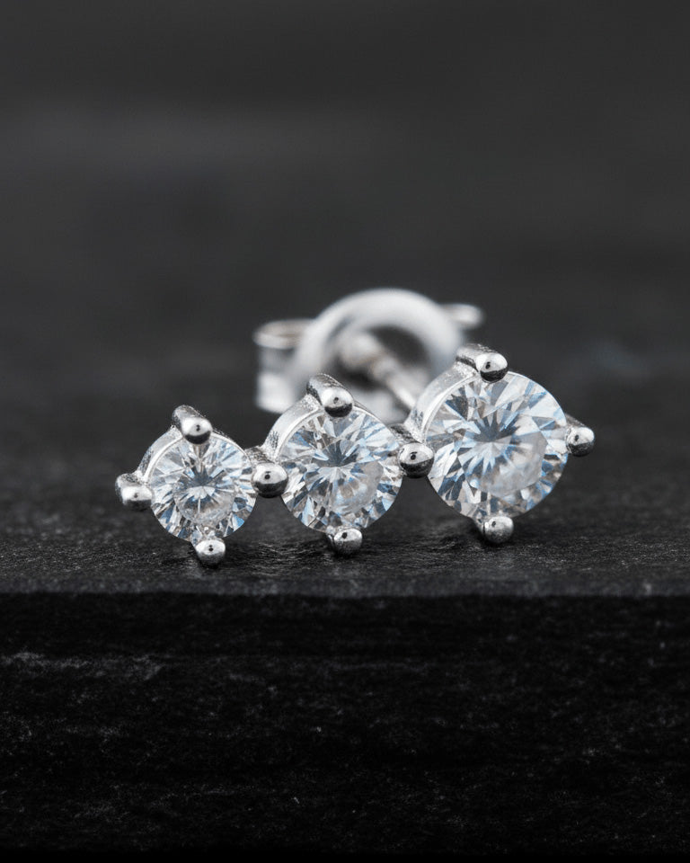 Three graduated round CZ stones stud earring.