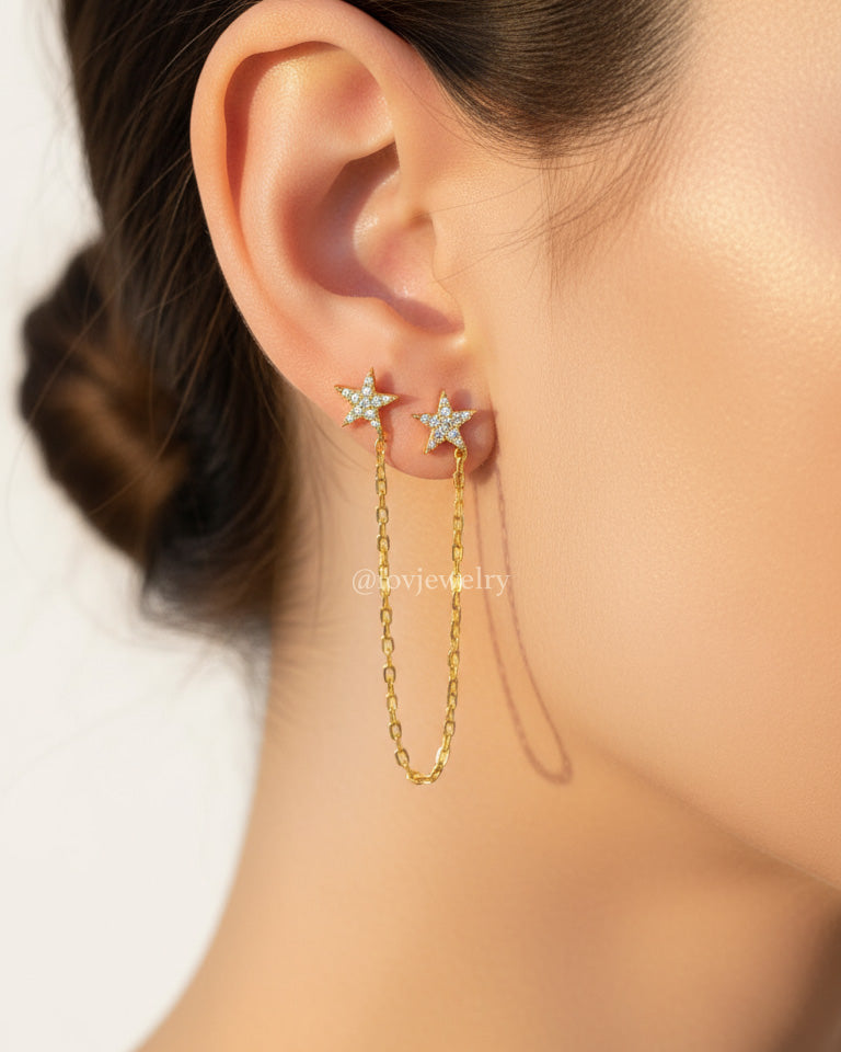 double CZ star stud earring linked with a delicate chain.